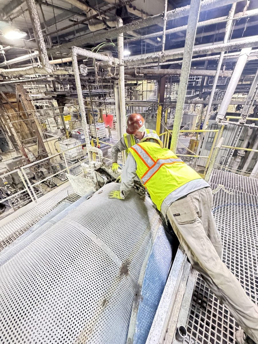 OCS crew working on industrial equipment